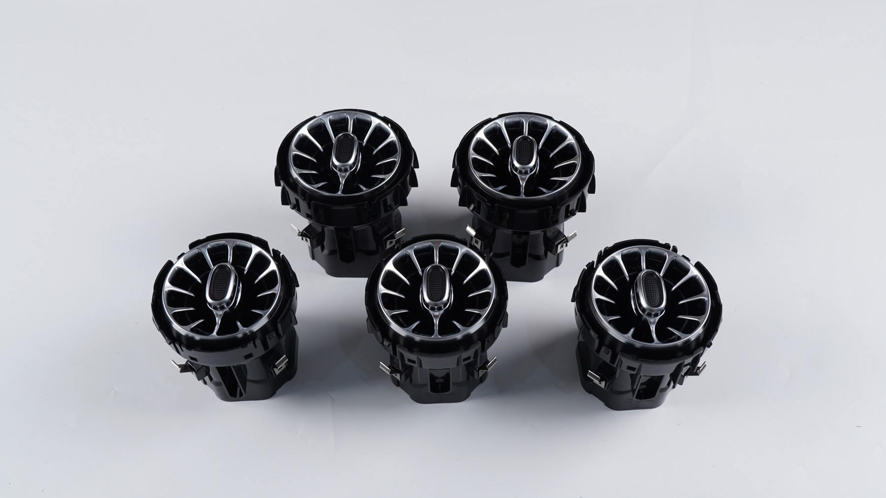 Five physical turbine-style front air vents photographed together