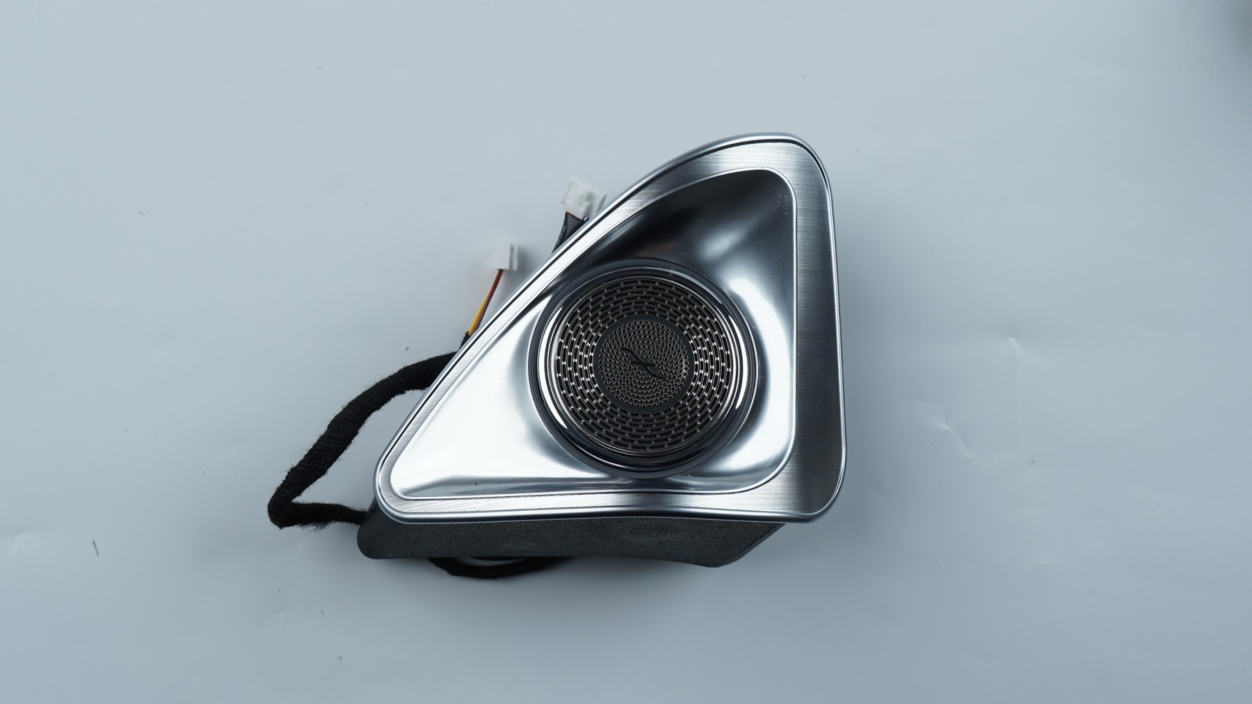 A physical CKCP rotating tweeter with its triangular housing and connector