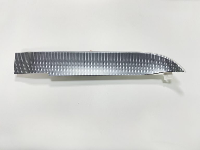 Illuminated passenger-side dashboard trim